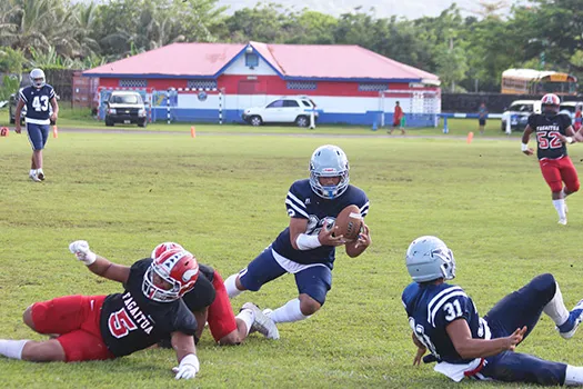 Johnson Talauega intercepting a pass from Fitu Amata of