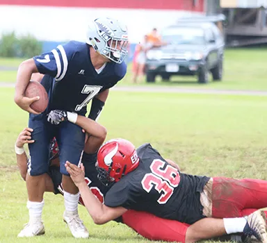 Samoana Sharks quarterback Viliamu Tanielu is sacked 