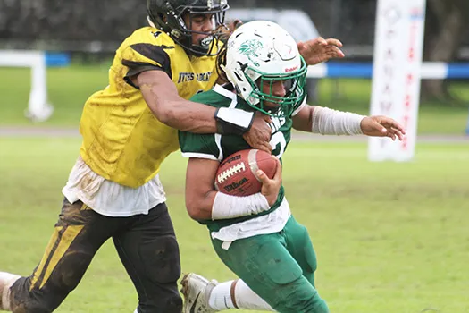 Freshman running back for Leone, Wylan Faga is tackled