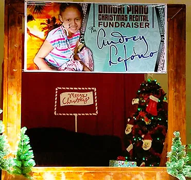A banner with the photo of 10-year-old Audrey Lefono