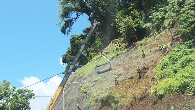 Workman on Mauga-O-Ali’i hillside