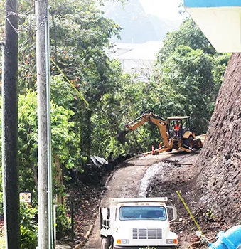 Road to Governor's Mansion with heavy equipment working to widen it.