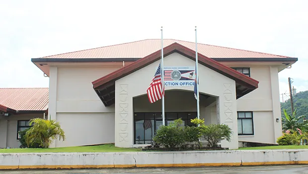 Flags at half staff in front of election office