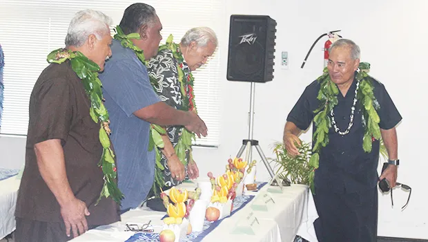 Gov. Lolo Matalasi Moliga shaking hands with traditional leaders 