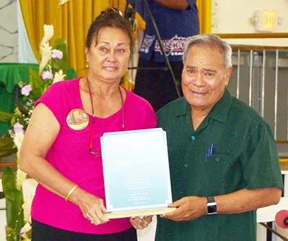 Lydia Faleafine-Nomura (left) and Gov. Lolo Matalasi Moliga (right) pose for a photo