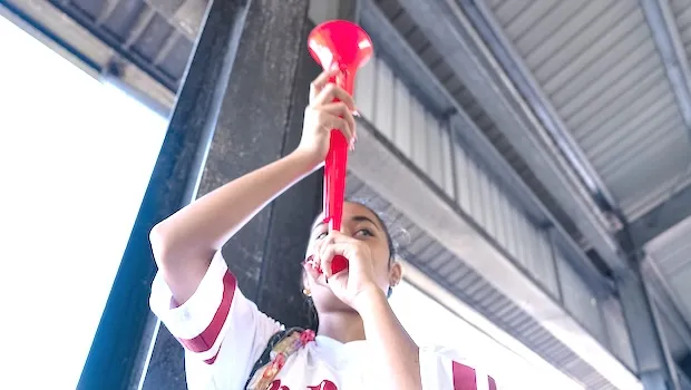 Nu'uuli VocTech graduate blowing horn