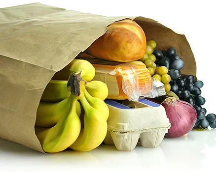 Paper bag with groceries showing