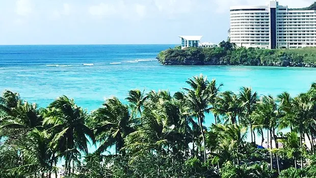 Photo of large hotel building in the distance in Guam