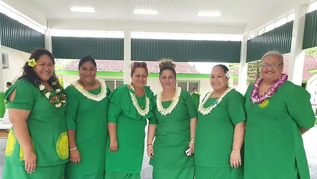 Teachers and principal pictured inside new gym