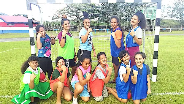 Youngsters with handball players after a handball fun program