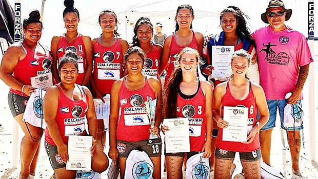 The nine-member Women's Under-18 Handball American Samoa team that will be competing in the 2018 Youth Olympics in October, in Buenos Aires, Argentina. The team is pictured with the American Samoa Handball Association president and coach, Carl Sagapolutele Floor Sr. (far right) at their new handball field next to Night Hawk Maliu Mai Resort.[photo: Leua Aiono Frost]