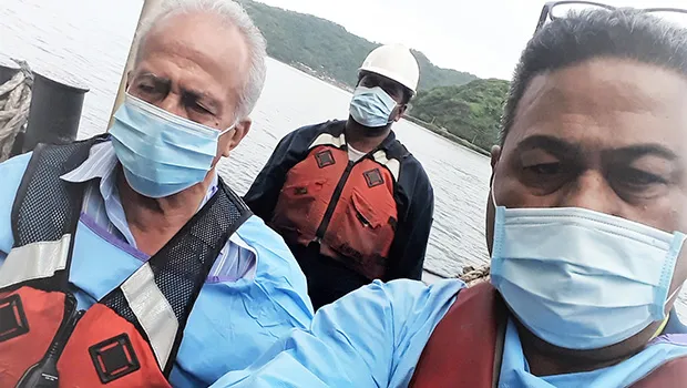 Harbor Master Silila Patane (left), Health official John Fuimaono (right) unnamed man in background