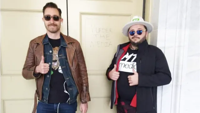 Proud Boys Nick Ochs, left, and Nicholas DeCarlo pose