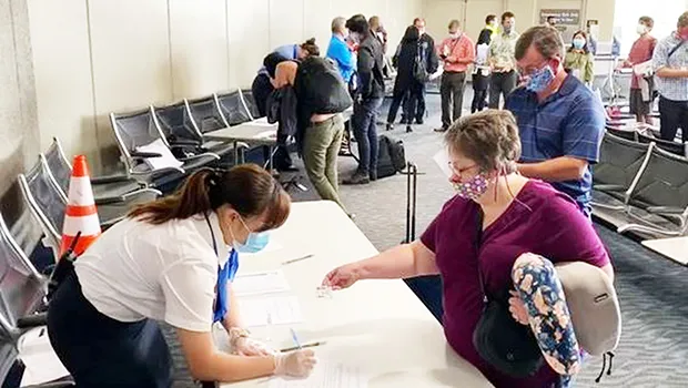 Woman being screened at a Hawaii airport