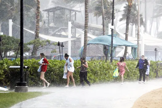 People running through the rain
