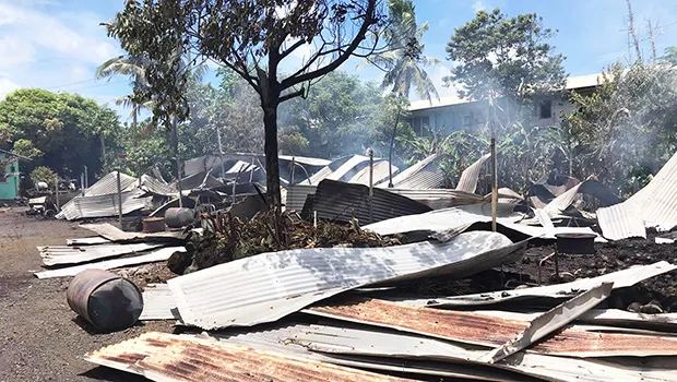 roofing iron smoldering and spread around on the ground