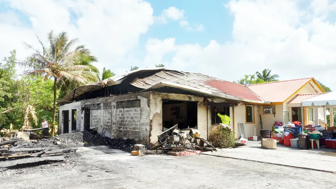 Partially burned home in Nuuuli