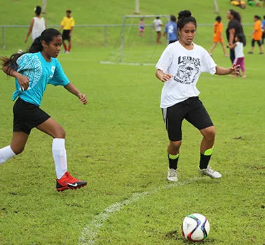 A Tafuna Jets player (left) and Ilaoa & To’omata opponent in action  