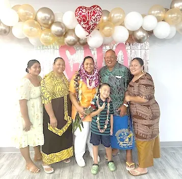 cna grad with family