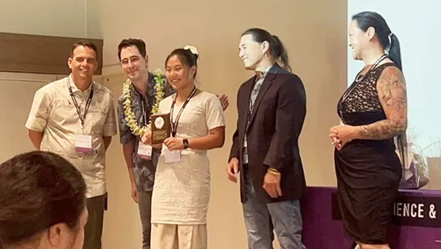Amelie Chen and her parents at winners' ceremony