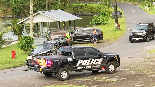 Wrecked truck involved in traffic accident with police cars