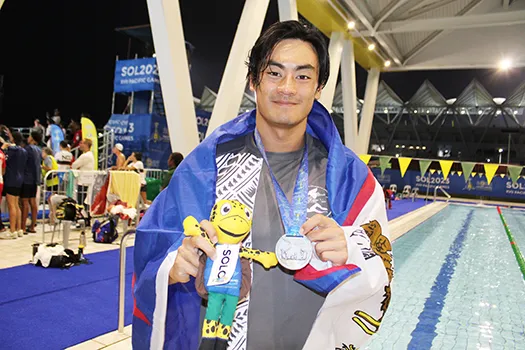 Micah with medal