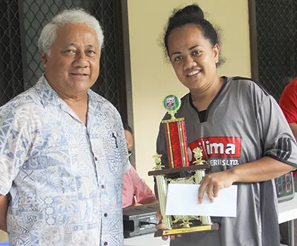 Salevu Filiva’a of Taputimu Youth receives her women’s 2018 FFAS National League MVP award from FFAS President, Sen. Faiivae Iuli Alex Godinet 