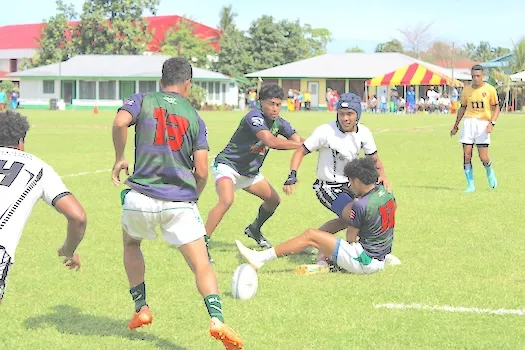 Barbarians and Bula Fiji players scramble for the ball 