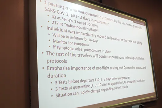 A large screen displayed information on the local resident who tested positive for COVID-19