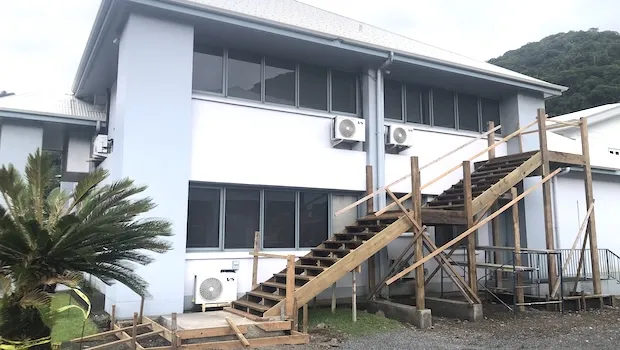 wooden stairway being built onto District Court building