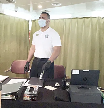 Jake Tagaloa with a mask and gloves protecting himself and others from the virus