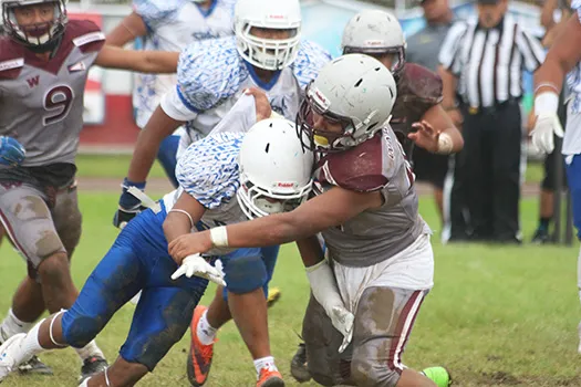 Marcus Samia hit hard by a Warrior defender