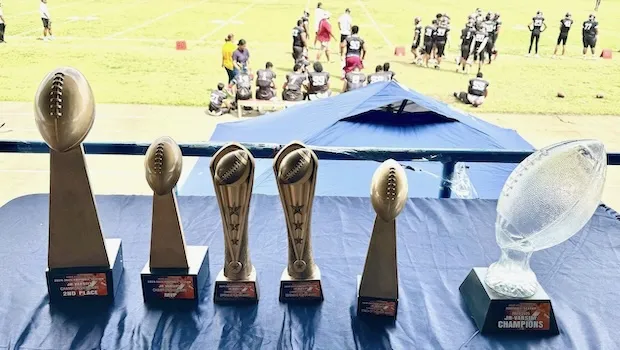 JV playing field with trophies in the foreground