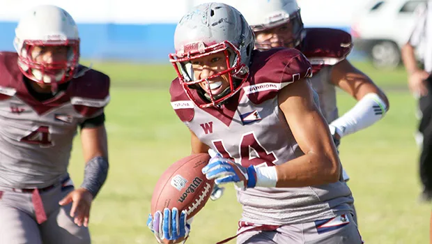 Joseph Lagai of the Warriors storming towards the end zone