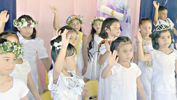 Some members of  K-5 Fatuoaiga Montessori School performing at their graduation ceremony