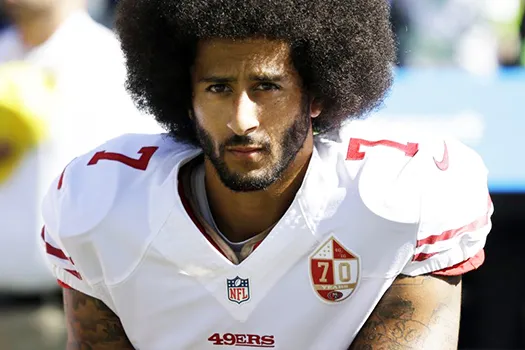 Colin Kaepernick kneels