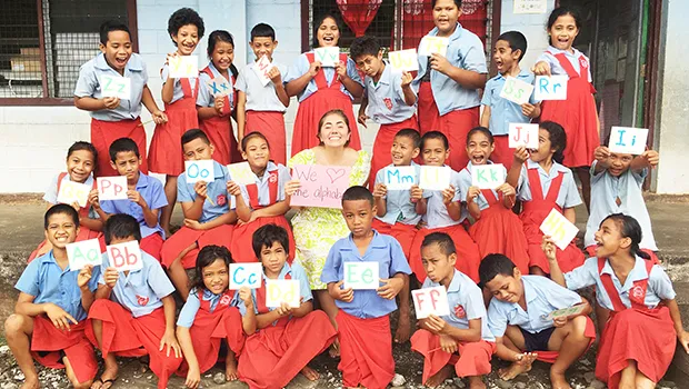 A U.S. Peace Corps volunteer in Samoa with her elementary students