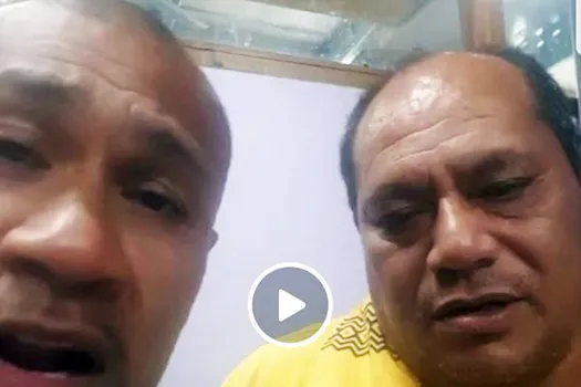 King Faipopo and a relative during a live broadcaast last night 
