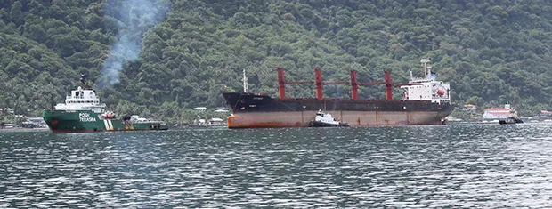 The North Korean cargo ship, Wise Honest, (middle) inside Pago Pago Harbor around 12noon last Saturday, towed in by towing vessel Posh Terasea (front). 