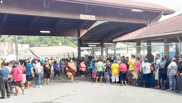 Crowds waiting for cargo off Lady Naomi 