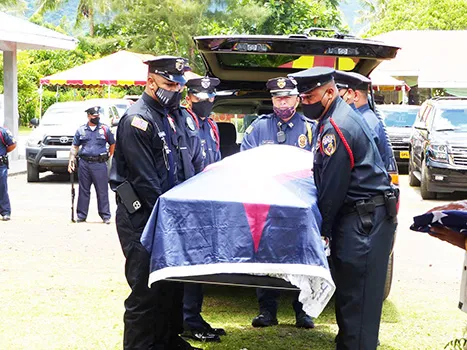 American Samoa flag draped casket of the late former Sen. Tulifua Tini Lam Yuen with police escorte