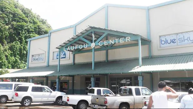 Laufou Shopping Center entrance and parking lot.