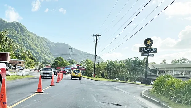 Traffic cones on road in from of CBT and Laufou