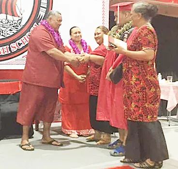 Gov Lemanu and First Lady Ella with others on stage at Faga'itua graduation