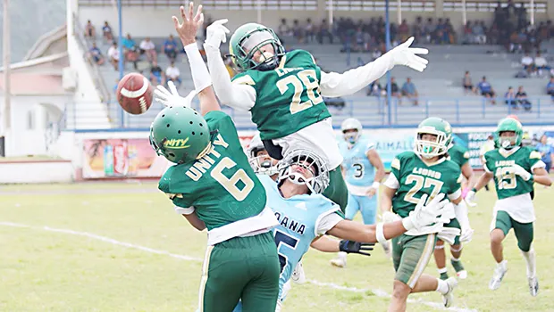 Two Leone Lions bat down the ball