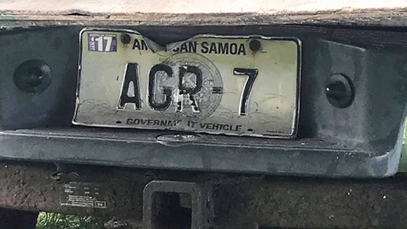 The license plate of the Department of Agriculture vehicle 