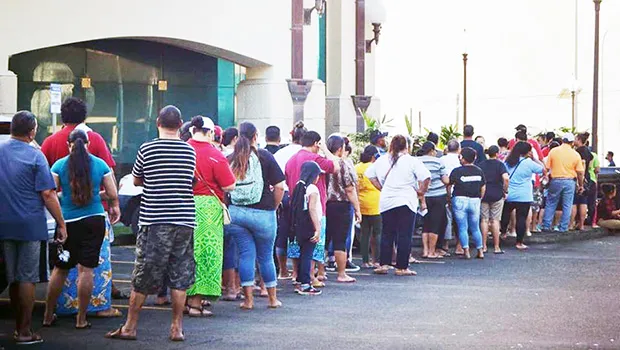 People standing in line to cash stimulus checks