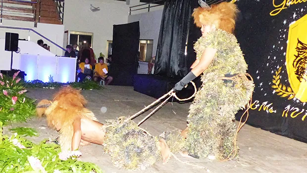 Two students dressed as lions