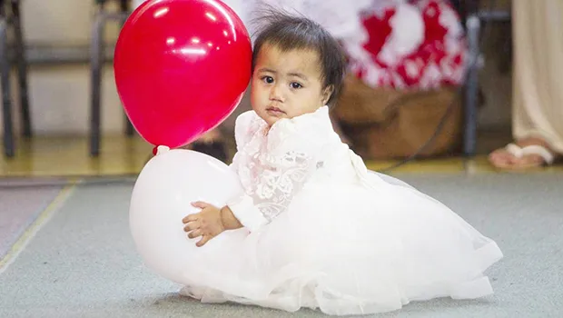 Little girl in her White Sunday finery