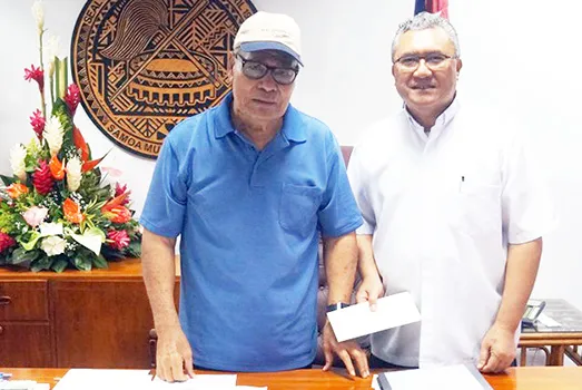 Gov. Lolo Matalasi Moliga in a photo from Tuesday, July 23, 2019 with Monsignor Viane Etuale